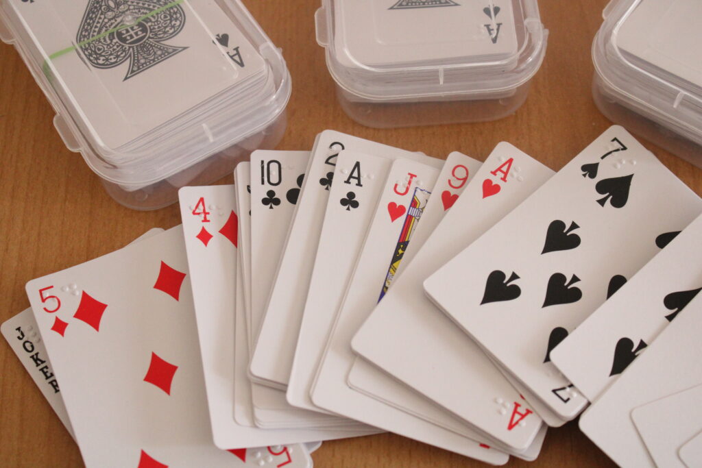 Play cards adopted with brail on edges.